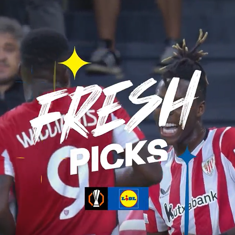 Fudbaleri u crveno-belim dresovima sa tekstom „FRESH PICKS“ i Lidl logom.