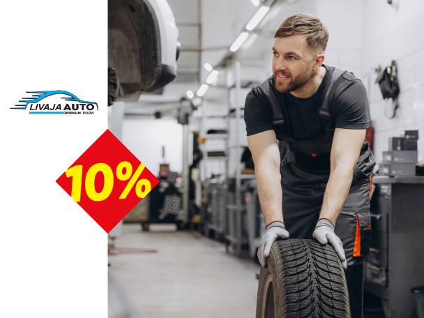 Mehaničar u radionici sa gumom, sa logom „LIVAJA AUTO“ i popustom od 10%.