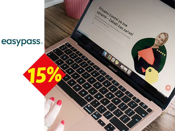 Laptop sa ekranom koji prikazuje reklamu za privatne časove i popust od 15%.