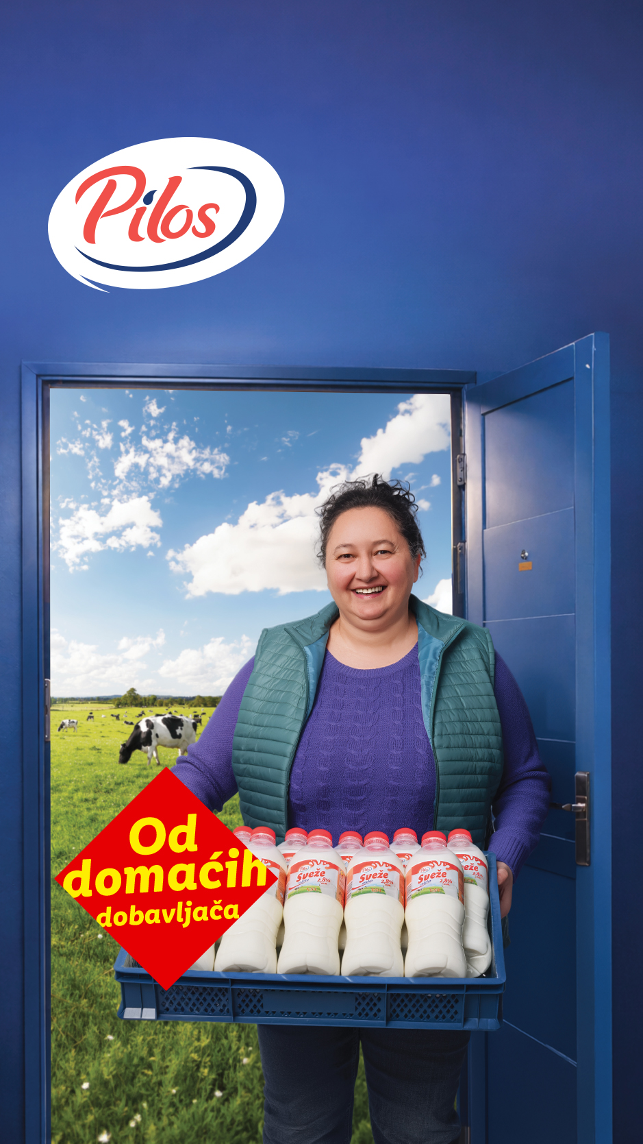 Žena isporučuje gajbu mleka, sa natpisom 'Od domaćih dobavljača' i kravama na pašnjaku u pozadini.