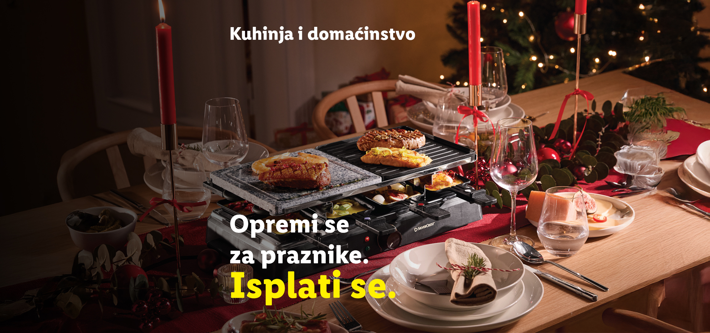 Raclette roštilj i praznična dekoracija stola sa tekstom: „Kuhinja i domaćinstvo. Opremi se za praznike. Isplati se.“