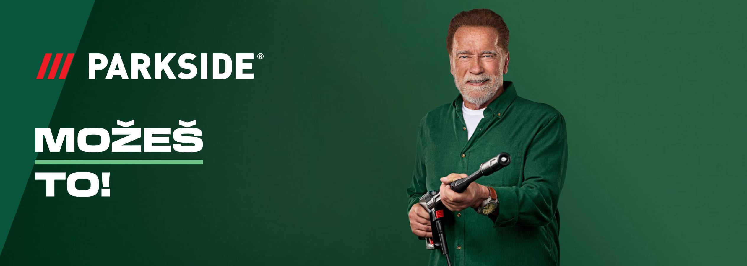 Arnold Švarceneger drži pištolj za pranje pod pritiskom na zelenoj pozadini sa tekstom „MOŽEŠ TO!“