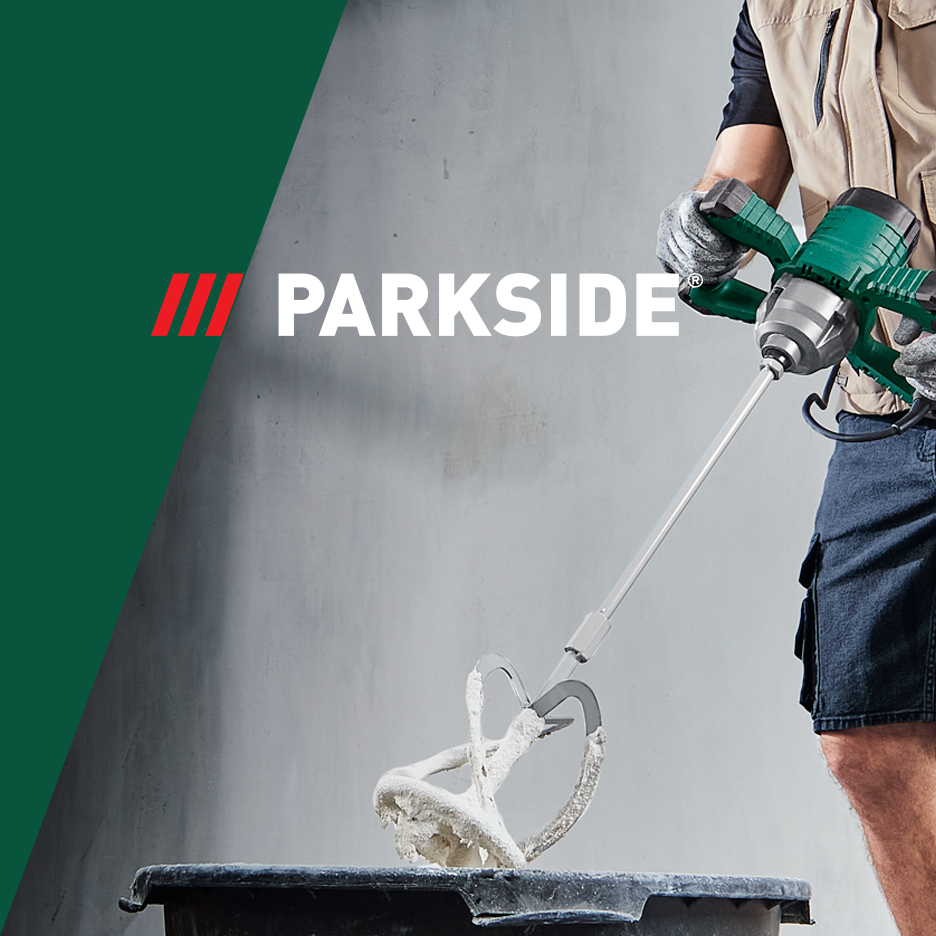 Parkside mešač za malter u upotrebi, meša beli malter u crnoj kanti.