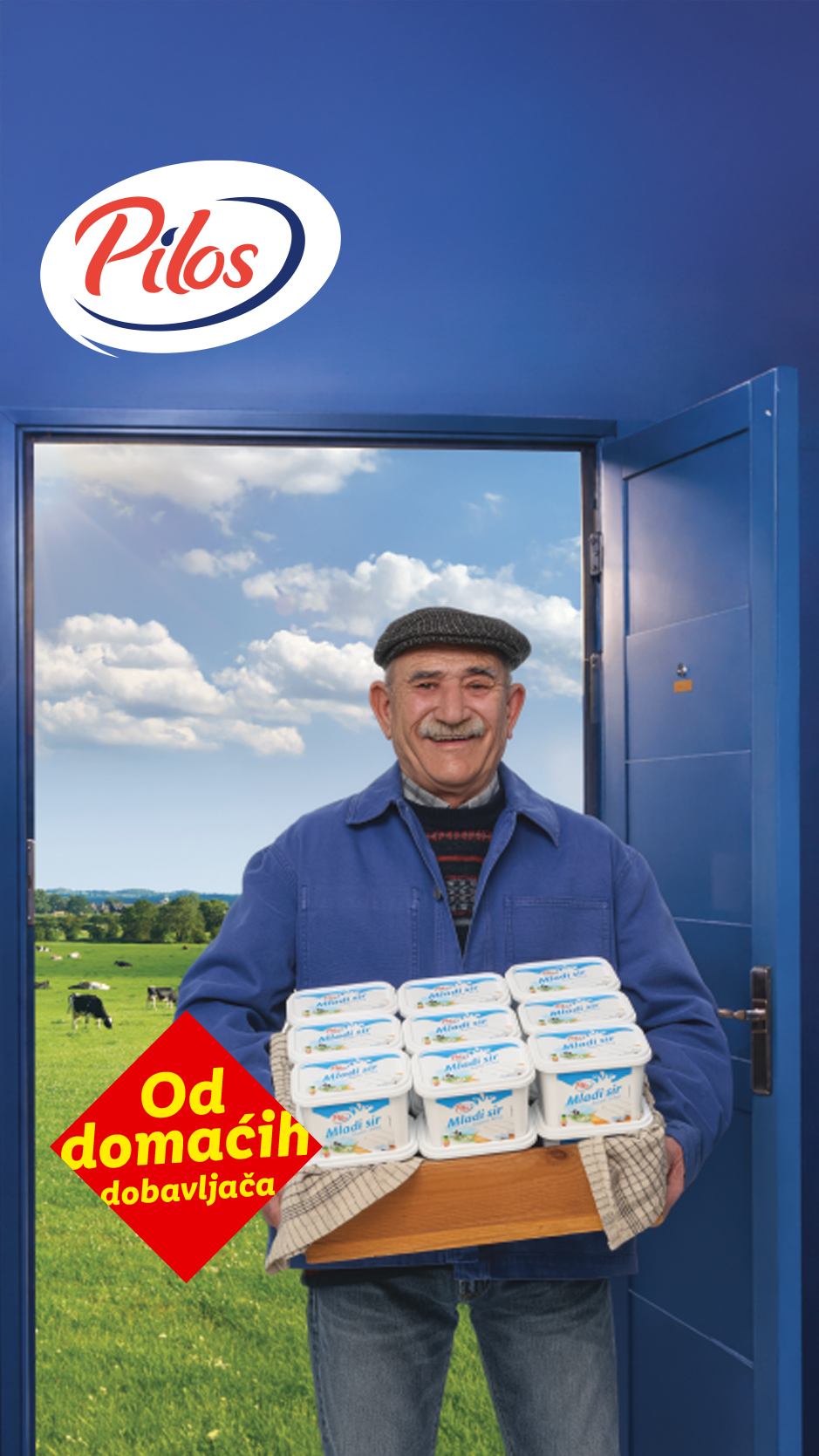 Nasmejani farmer nosi gajbu punu mladog sira, sa natpisom „Od domaćih dobavljača“.