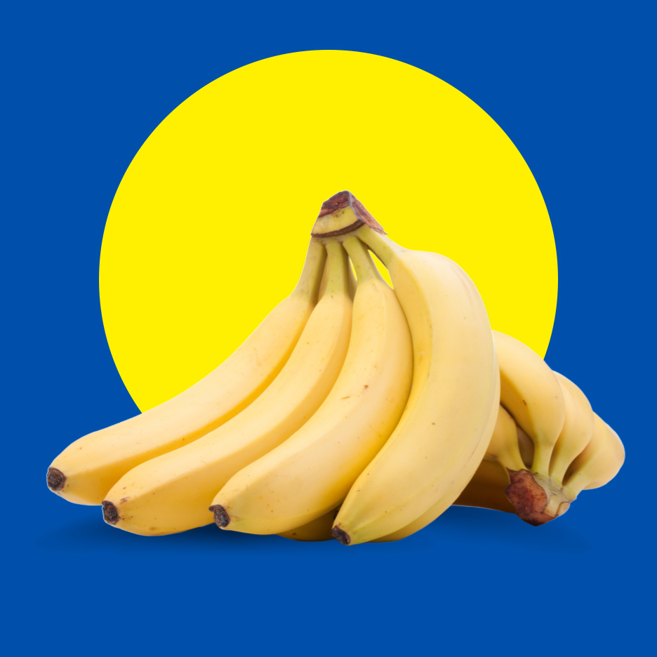 Zreli žuti grozd banana na plavoj pozadini sa žutim krugom.