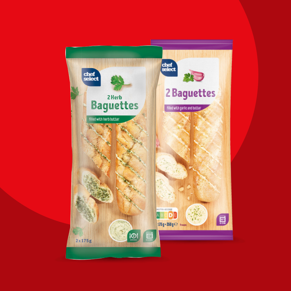 Dve kese bageta, jedna sa začinskim biljem, druga sa belim lukom i puterom.