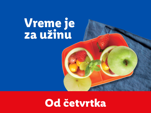 Voćna salata u jabukama i natpis „Vreme je za užinu“.